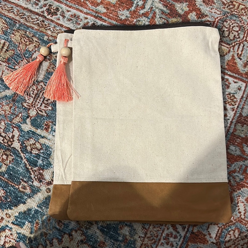 Canvas and brown goat leather with pink tassel and pattern interior. 13x11 in